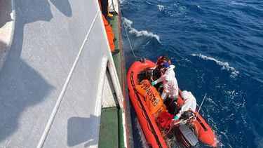 This handout photo taken and released on September 21, 2026 by Indonesia's Search and Rescue Agency (BASARNAS) shows search and rescue personnel onboard a small rigid inflatable boat with a body bag containing a victim from the MV Virgo Transport 8, alongside their ship in the Java Sea off South Kalimantan. The Virgo Transport 8 was carrying 213 passengers and 30 crew when it lost contact with its shipping company after departing from Indonesia's second city of Surabaya on Java island, headed for Banjarmasin on Borneo.
Handout / Indonesia's Search and Rescue Agency (BASARNAS) / AFP