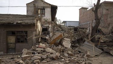 epa11039541 Rubble on the ground at a house damaged by the earthquake in Dahejia, Gansu Province, China, 21 December, 2023. A 6.2 earthquake hit the region on 18 December killing more than 100 people.  EPA/ANDRES MARTINEZ CASARES