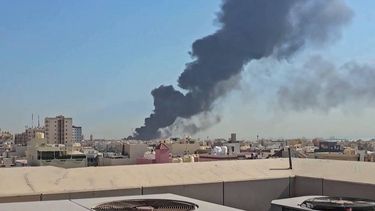 This screen grab taken from UGC video footage posted on social media on July 18, 2026, shows a plume of black smoke billowing over the town of Mangaf, south of Kuwait City. Kuwait accused Iran on July 18 of targeting civilian sites and vital infrastructure in the country, after reporting attacks on an oil facility and a power and water plant.
UGC / UNKNOWN / AFP