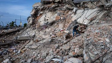 This photograph taken on July 2, 2026 in Caraballeda in the state of La Guaira shows volunteers looking for survivors in a collapsed building following the June 24 twin earthquakes. More than a week after the earthquakes struck, there is little chance of finding additional survivors from the two earthquakes that killed nearly 2,300 people, destroyed entire residential buildings, and left tens of thousands missing.
Miguel MEDINA / POOL / AFP