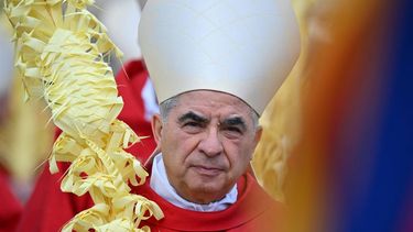 Italian Cardinal Giovanni Angelo Becciu takes par in the procession of the Palm Sunday mass on April 2, 2023 at St. Peter's square in The Vatican. 
Filippo MONTEFORTE / AFP