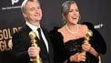 British director Christopher Nolan (L) and spouse British film producer Emma Thomas pose in the press room with the awards for Best Director - Motion Picture and Best Motion Picture - Drama for 