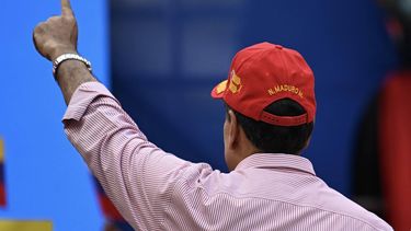 Venezuela's President Nicolas Maduro gestures to supporters during a rally in Caracas on December 1, 2025. Venezuela does not want 