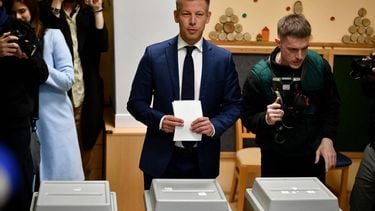 Peter Magyar (C), leader of the pro-European conservative TISZA party, prepares to cast his ballot at a polling station set up in a kindergarten in Budapest during a general election in Hungary, on April 12, 2026. The vote could end Hungarian Prime Minister Viktor Orban's 16-year stint in power as the EU's longest serving current leader and a self-decribed 