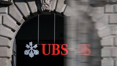 This photograph shows a sign of Swiss giant banking UBS at a branch in Zurich on March 4, 2026.  
Fabrice COFFRINI / AFP