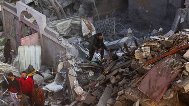 Palestinians inspect the destruction of buildings following Israeli airstrikes in the refugee camp in Rafah, southern Gaza Strip, on December 1, 2023, as fighting broke out shortly after the expiration of a seven-day truce between Israel and Hamas. A temporary truce between Israel and Hamas expired on December 1, with the Israeli army saying combat operations had resumed, accusing Hamas of violating the operational pause. 
SAID KHATIB / AFP