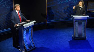 US Vice President and Democratic presidential candidate Kamala Harris speaks as former US President and Republican presidential candidate Donald Trump listens during a presidential debate at the National Constitution Center in Philadelphia, Pennsylvania, on September 10, 2024. 
 
SAUL LOEB / AFP