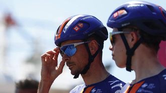 Team Picnic PostNL French rider Warren Barguil (L) looks on as he prepares to compete in the 12th stage of the Giro d'Italia 2026 - Tour of Italy cycling race between Imperia and Novi Ligure, Italy, on May 21, 2026. 
Luca Bettini / AFP