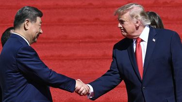 US President Donald Trump shakes hands with China's President Xi Jinping after a visit with First Lady Melania Trump and China's First Lady Peng Liyuan to the National Archives in Washington, DC on September 25, 2026. The rotunda at the National Archives permanently houses the Declaration of Independence, Bill of Rights and the US Constitution.

SAUL LOEB / AFP
