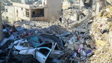 People stand on the rubble of a building destroyed in an overnight Israeli airstrike on the southern Lebanese town of Saksakiyeh on November 12, 2024, as the war continues between Israel and the Lebanese Hezbollah group. Lebanon's health ministry said an the strike killed at least seven people on November 11, with state media reporting women and children among the dead.
Mahmoud ZAYYAT / AFP