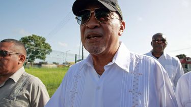 Suriname's former President Desi Bouterse, accompanied by bodyguards, speaks to the press after his final word in his appeal case against the Court Martial at the High Court of Justice in Paramaribo, on July 31, 2023. The prosecution repeated the demand for 20-years jail time for his involvement in the murder of 15 people when he ruled in 1982 during his military government.
Ranu Abhelakh / AFP