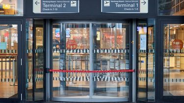 epa10959467 A view of an airport entrance as police secures the area outside the airport in Hamburg, Germany, 05 November 2023, after an armed man broke through security and entered the grounds of the airport the previous day. Hamburg police confirmed on 05 November that the 'static hostage situation' at the airport came to an end when the suspect got out of the car with his daughter and was arrested without opposing resistance. The child appeared to be unharmed, police said.  EPA/GEORG WENDT