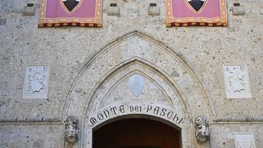 A view shows the main entrance of the Palazzo Salimbeni, the building that houses the main offices of the Banca Monte dei Paschi di Siena, one of the the oldest banks in the world, on July 2, 2022 in Siena, Tuscany. 
Alberto PIZZOLI / AFP