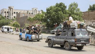 A family flees as it drives behind Saudi-backed Yemeni government forces ride in a pick-up truck near the Jabal Han front, west of the city of Taiz, following fierce battles earlier in the day against Yemen's Houthis as they reportedly attempted to seize control of the main route between the inland city of Taiz and the coastal city of Aden, on October 3, 2026. Fighting in Taiz has raged since the Iran-backed Houthis began a lightning offensive against the internationally-recognised, Saudi-backed government. The civil war, which dates to 2014 but had been dormant following a truce in 2022 roared back to life in July, as the wider Middle East war ignited another front. The Houthis, a predominantly Zaidi Shia group whose heartlands lie in the north of the country, have since early in the war controlled most of Yemen's populated areas. The internationally recognised government, which has been backed militarily by a Saudi-led coalition since 2015, controls the south including the port city of Aden.

AHMAD AL-BASHA / AFP