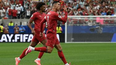 Portugal's forward #07 Cristiano Ronaldo (R) celebrates after scoring the opening goal during the 2026 World Cup Group K football match between Portugal and Uzbekistan at the Houston Stadium in Houston on June 23, 2026. 

RONALDO SCHEMIDT / AFP