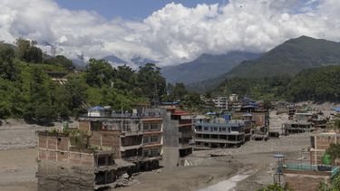 epa13194178 Floodwaters sweep through Trishuli Bazar following a flash flood, in Nuwakot district, Nepal, 26 August 2026 27 August 2026. More than 160 people have died and hundreds remain missing across northern Nepal after a suspected avalanche triggered massive flash floods and mudslides along the Bhotekoshi and Trishuli river near the Nepal-Tibet border, causing widespread destruction to settlements and infrastructure, according to local authorities.  EPA/NARENDRA SHRESTHA