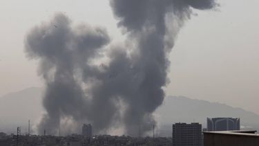 A plume of smoke rises following a reported explosion in Tehran on February 28, 2026. Two loud blasts were heard in Tehran on February 28 morning by AFP journalists, and two plumes of thick smoke were seen over the centre and east of the Iranian capital. Israel's defence ministry announced it had launched a 