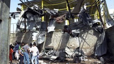 GAZ01 - 20010521 - JABALIA, GAZA STRIP, - : Palestinians sort through the remains of a factory destroyed by Israeli rockets 21 May 2001 in Jabalia on the northern outskirts of Gaza City. Israeli helicopters blasted missiles and machine gun fire at Palestinian factories and security buildings in the Gaza Strip wounding four people and damaging homes. EPA PHOTO AFPI/SCOTT NELSON/sen/lfb