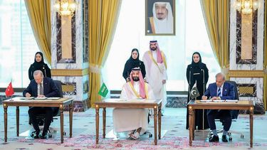 This handout photograph taken and released by Pakistan's Prime Minister's Office on August 7, 2026 shows Saudi Crown Prince Mohammed bin Salman (C), Turkish President Recep Tayyip Erdogan (L) and Pakistani Prime Minister Shehbaz Sharif signing the Mecca Joint Defence Agreement in Mecca, Saudi Arabia. Saudi Arabia, Turkey and Pakistan signed a joint defence agreement on August 7 amid violence in the region from Houthi attacks and the US-Iran war.
Handout / Pakistan Prime Minister's Office / AFP