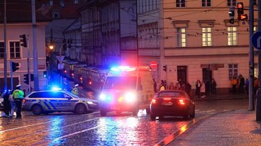 epa11039961 An ambulance rushes to the scene of a shooting in central Prague, 21 December 2023. According to Czech Police several people have been killed and 