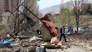 epa12868676 People walk amid the debris after US-Israeli airstrikes on the Shahid Beheshti University, in Tehran, Iran, 04 April 2026. A joint Israeli and US military operation, launched on 28 February, continues to target multiple locations across Iran.  EPA/ABEDIN TAHERKENAREH