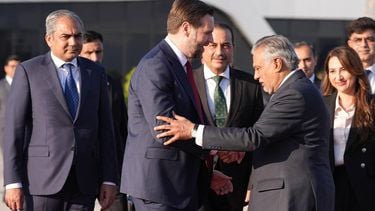 US Vice President JD Vance (C) shakes hands with Pakistani Deputy Prime Minister and Foreign Minister Mohammad Ishaq Dar (3rd R), as Pakistan's Interior Minister Mohsin Naqvi (L), Pakistan's Chief of Defence Forces Chief of Army Staff Field Marshall Asim Munir (centre R) and Charge d'Affaires of the U.S. Embassy in Islamabad Natalie A. Baker (2nd R) look on, as he prepares to board Air Force Two after attending talks on Iran in Islamabad on April 12, 2026. Iran and the United States failed to reach an agreement to end the war in the Middle East, US Vice President JD Vance said April 12 after marathon talks in Islamabad, adding that he was leaving negotiations after giving Tehran the 