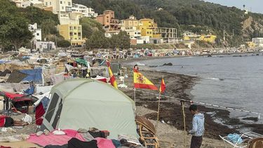 epa13216498 A migrant stands near makeshift tents erected by migrants along Trampolin Beach in Ceuta, Spain, 06 September 2026. Ceuta President Juan Jesus Vivas is expected to meet European Commissioners Magnus Brunner and Dubravka Suica and European Parliament President Roberta Metsola in Brussels on 08 September to discuss the migration crisis. Thousands of people crossed from Morocco into the Spanish North African enclave in late July 2026.  EPA/REDUAN