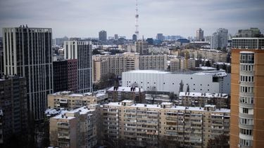 This photograph shows a general view of a residential area in central Kyiv on February 19, 2026, amid the Russian invasion of Ukraine. As Ukraine accuses Russia of trying to freeze the population into submission with its most intense attacks on the energy network of the entire war, more and more people in Kyiv are fundraising and pooling cash to buy alternative sources of shared electricity.
HENRY NICHOLLS / AFP