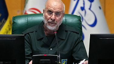 (FILES) In this handout picture provided by Ithe Islamic Consultative Assembly News Agency (ICANA), Iran’s Parliament Speaker Mohammad Bagher Ghalibaf, dressed in an IRGC uniform, chairs a session in Tehran on February 1, 2026. Iran's powerful parliament speaker Ghalibaf, in an X post in English, warned Washington on March 25, 2026, not to test the Islamic republic's determination to defend its territory after the United States was reported to be sending more troops to the Middle East. On February 28, Israel and the United States launched strikes on Iran killing its supreme leader and triggering a war that spread across the Middle East and unleashed chaos across global markets.
ICANA NEWS AGENCY / AFP