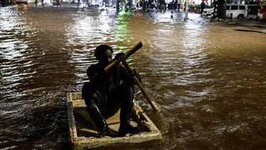 epaselect epa12800343 A Kenyan man is seen crossing flooded road using a makeshift raft during heavy rain in Nairobi, Kenya, 06 March 2026. The storm leaves many motorists and passengers stranded during the evening rush hour. The Kenya Meteorological Department warns of heavy rainfall in Nairobi and surrounding counties over the next 24 hours.  EPA/DANIEL IRUNGU