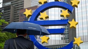 A man shelters from the rain under an umbrella as he walks past the Euro currency sign in front of the former European Central Bank (ECB) building in Frankfurt am Main, western Germany, on July 27, 2023 ahead of thr ECB's monthly announcement on eurozone monetary policy. 
Kirill KUDRYAVTSEV / AFP