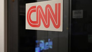 A sign on the office for CNN in the White House briefing room isk seen in Washington, DC, on September 21, 2026. Three leading US news outlets announced on September 21 they will go to court after being banned from the White House, as President Donald Trump claimed that media critical of his administration is a 