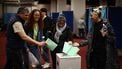 Voters cast their ballots in the Hungarian election inside the polling station set up at a hotel in west London, on April 12, 2026. The vote could end Hungarian Prime Minister Viktor Orban's 16-year stint in power as the EU's longest serving current leader and a self-decribed 