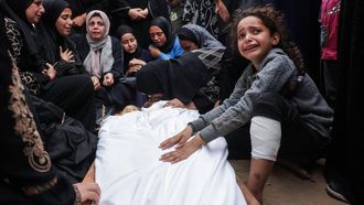 Relatives mourn over the bodies of two children killed in an Israeli strike, at Nasser Hospital in Khan Yunis in the southern Gaza Strip, on October 29, 2025. Gaza's civil defence agency said on October 29 that overnight air strikes killed at least 50 people in the Palestinian territory, as the Israeli military hit a string of targets after an attack that left a soldier dead. Israel began carrying out air strikes on October 28 after accusing Hamas of attacking Israeli troops in Gaza and violating the truce.
BASHAR TALEB / AFP