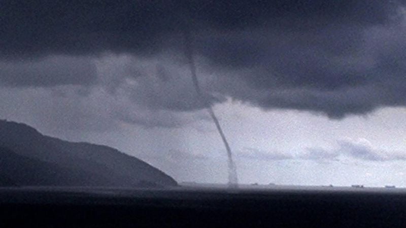 epa00162894 A tornado is seen from the Santos Fishing Club, in Ponta de la Playa, on the outskirts of Sao Paulo, Monday 29 March 2004. A cyclone that hit southern Brazil Sunday killed two people and left hundreds homeless as meteorologists debated whether it was the first hurricane ever recorded in the southern Atlantic Ocean. Winds exceeded 150 kilometres per hour and did damage in 20 cities, demolishing hundreds of trees. Officials worried that the death toll could rise because numerous people were missing on land and at sea. Two fishing boats with a total of 13 people on board, for instance, had not returned to port before the storm called Catarina hit. EPA/NATALIA BARLETTA RAMOS BRAZIL OUT