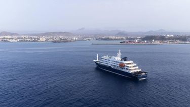 This aerial picture shows a general view of the cruise ship MV Hondius stationary off the port of Praia, the capital of Cape Verde, on May 5, 2026. The WHO said on May 5, 2026 that Spain would 