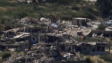 An Israeli flag held on top of a destroyed building in the southern Lebanese village of Kfar Kela near the border is pictured from the Upper Galilee in northern Israel, on June 4, 2026 Lebanese Prime Minister Nawaf Salam said on June 4 that the army would begin deploying in 