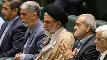 (FILES) Iran's Minister of Intelligence Esmail Khatib (C) sits with Iran's President Masoud Pezeshkian (C-R) before a speech to defend his cabinet selection to members of parliament in the capital Tehran on August 17, 2024. Israeli Defence Minister Israel Katz said on March 18, 2026 that Israeli forces had killed Khatib. Iran meanwhile vowed revenge as it prepared the funeral for its security chief Ali Larijani, firing off a wave of missiles against Israel while also reporting fresh Israeli-US strikes across the Islamic Republic.
ATTA KENARE / AFP