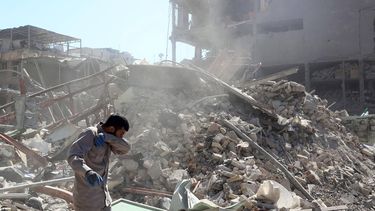 epa12791335 An official works at a damaged building around Ferdowsi Square after an airstrike in central Tehran, Iran, 03 March 2026. A joint Israeli and US military operation continues to target multiple locations across Iran since the early hours of 28 February 2026.  EPA/ABEDIN TAHERKENAREH