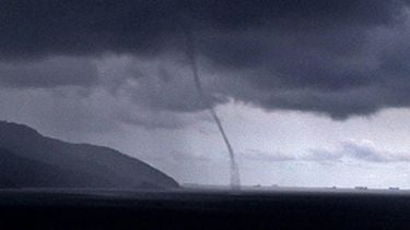 epa00162894 A tornado is seen from the Santos Fishing Club, in Ponta de la Playa, on the outskirts of Sao Paulo, Monday 29 March 2004. A cyclone that hit southern Brazil Sunday killed two people and left hundreds homeless as meteorologists debated whether it was the first hurricane ever recorded in the southern Atlantic Ocean. Winds exceeded 150 kilometres per hour and did damage in 20 cities, demolishing hundreds of trees. Officials worried that the death toll could rise because numerous people were missing on land and at sea. Two fishing boats with a total of 13 people on board, for instance, had not returned to port before the storm called Catarina hit. EPA/NATALIA BARLETTA RAMOS BRAZIL OUT