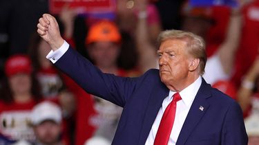 Former US President and Republican presidential candidate Donald Trump gestures at the end of a campaign rally at PPG Paints Arena in Pittsburgh, Pennsylvania on November 4, 2024.  
CHARLY TRIBALLEAU / AFP