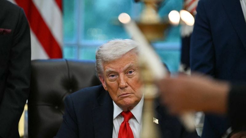 US President Donald Trump looks on as candles are lit during a Diwali celebration with American Indian leaders in the Oval Office of the White House in Washington, DC, on October 21, 2025. 
ANDREW CABALLERO-REYNOLDS / AFP