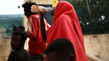 A migrant drinks water outside the CETI short-stay migrant centre in the Spanish North African enclave of Ceuta on August 1, 2026. At least 67 people have died in a recent surge of migrant crossings from Morocco to Spain's North African enclave of Ceuta, Spain's Interior Minister said today. Most of the 60,000 migrants who entered Ceuta over the space of a few days from neighbouring Morocco have already returned to Morocco.
Henry Nicholls / AFP