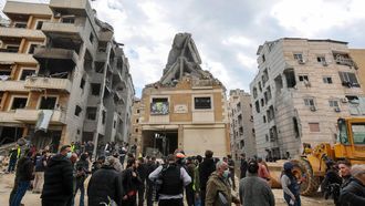 epa12880665 Journalists and people gather around a building hit by recent Israeli air strikes, during a press tour organized by the Hezbollah media office, in the Five Wings residential area, in the southern suburbs of Beirut, Lebanon, 10 April 2026. According to the Lebanese Ministry of Public Health, Israeli attacks across Lebanon have killed at least 1,888 people and injured more than 6,092 others since the start of renewed hostilities between Israel and Hezbollah on 02 March 2026.  EPA/WAEL HAMZEH