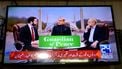 epa12882356 Vice President of the United States JD Vance (L) with Pakistani Prime Minister Shehbaz Sharif (C) and Iran's parliamentary Speaker Mohammad Bagher Ghalibaf (R) appear on a television screen during US-Iran talks, in Peshawar, Pakistan, 11 April 2026. An Iranian and US delegation arrived in Islamabad for planned peace talks amid a fragile two-week ceasefire following the conflict that began on 28 February 2026.  EPA/BILAWAL ARBAB
