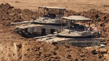 This picture taken from a position in the Upper Galilee in northern Israel shows Israeli tanks positioned along the border with southern Lebanon on June 22, 2026. After a first round of US-Iran talks in Switzerland on ending the Middle East war, mediators Pakistan and Qatar said on June 22 that Tehran and Washington had agreed to set up a 