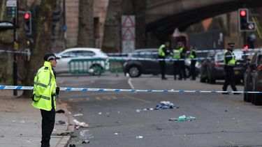 Police officers work near to a variety of personal items seen covering the road inside a cordon set up on Friar Gate in central Derby, central England on March 29, 2026, following an incident the night before where was vehicle has driven into pedestrians. British police said they arrested a man after a car struck several pedestrians in a city in central England on Saturday night, leaving some victims seriously injured.
Darren Staples / AFP