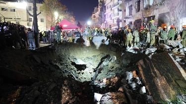 epa12785242 Emergency services at the scene after a building was struck by a Iranian missile in Tel Aviv, Israel, 28 February 2026. The Israeli military reported on 28 February it deteced missiles launched from Iran following earlier Israeli and US strikes. Sirens were activated across several parts of the country in response.  EPA/ABIR SULTAN