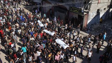 People carry the bodies of Palestinians released by Israel under a Gaza ceasefire and hostage exchange, during their funeral in the Bureij refugee camp in the central Gaza Strip on October 18, 2025. Israel returned the bodies of 15 Palestinians to Gaza on October 18, bringing the total number handed over to 135, the health ministry in the Hamas-run territory said.
Eyad BABA / AFP
