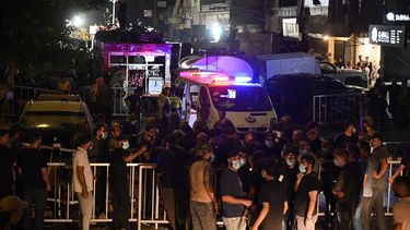 epa11616182 People and emergency personnel gather in front of a damaged building after an Israeli military strike, in Beirut, Lebanon, 20 September 2024. At least eight people were killed and dozens injured in the attack, which targeted the southern suburb of Beirut, according to the Lebanese Ministry of Health. The Israeli military stated on 20 September that it conducted a 'targeted strike' in Beirut, claiming that the 'Hezbollah Commanders we eliminated today' had been planning attacks on northern areas of Israel.  EPA/WAEL HAMZEH